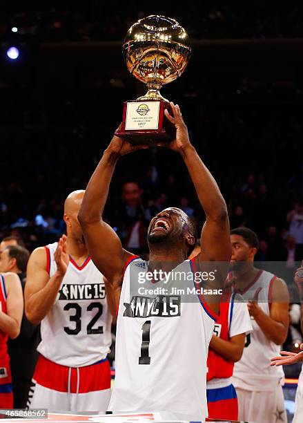 Comedian Kevin Hart celebrates with the MVP trophy after the Sprint NBA All-Star Celebrity Game at Madison Square Garden on February 13, 2015 in New...