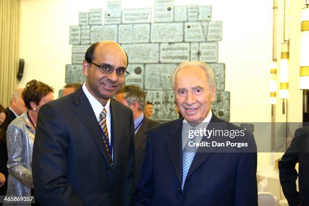 Deputy Prime Minister and Minister for Finance and Manpower in Singapore Tharman Shanmugaratnam poses with President of Israel Shimon Peres during a...