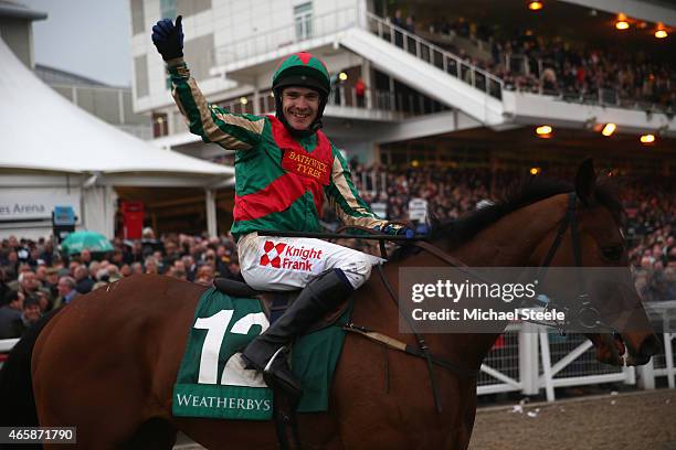 Tom Scudamore riding Moon Racer celebrates winning the Weatherby's Champion Bumper Open Natuonal Hunt Flat Race during day two of the Cheltenham...