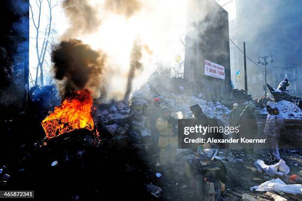 Anti-government Protesters gathered at a barricade during sunrise on Hrushevskoho Street on January 30, 2014 in Kiev, Ukraine. Ukraine's Prime...