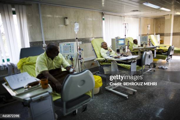 Iranian patients receive treatment at the dialysis ward in the Helal Iran Clinic on March 11, 2015 a day ahead of the World Kidney Day in the capital...