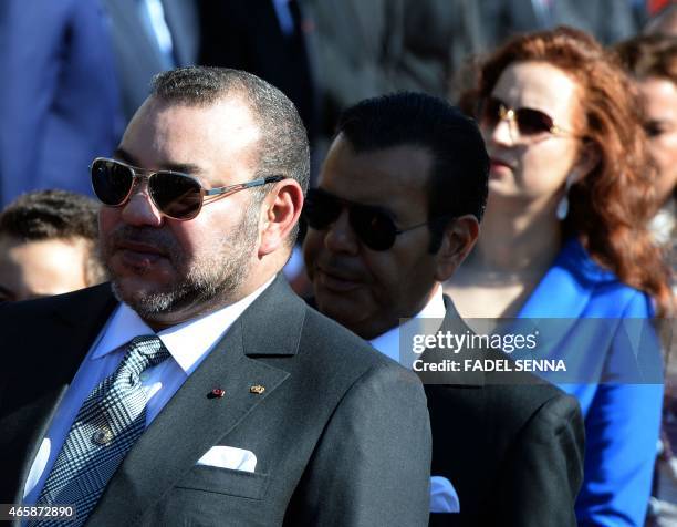 Moroccan King Mohammed VI , accompanied by his wife Princess Lalla Salma and Prince Moulay Rachid , walks alongside Jordan's King Abdullah II during...