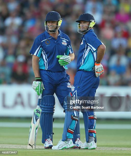 Adam Gilchrist and Greg Blewett look on while batting during the Ricky Ponting Tribute Match at Aurora Stadium on January 30, 2014 in Launceston,...