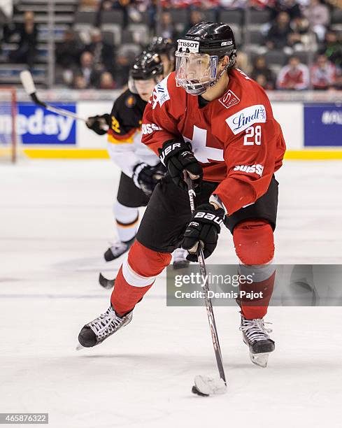 Forward Timo Meier of Switzerland moves the puck against Germany during the 2015 IIHF World Junior Championship on January 02, 2015 at the Air Canada...