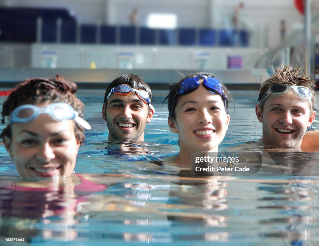 Four young adults in swimming pool