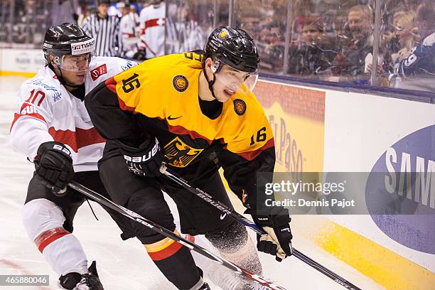 Defenceman Fabio Wagner of Germany skates against forward Kevin Fiala of Switzerland during the 2015 IIHF World Junior Championship on January 03,...