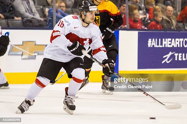 Forward Kay Schweri of Switzerland moves the puck against Germany during the 2015 IIHF World Junior Championship on January 03, 2015 at the Air...