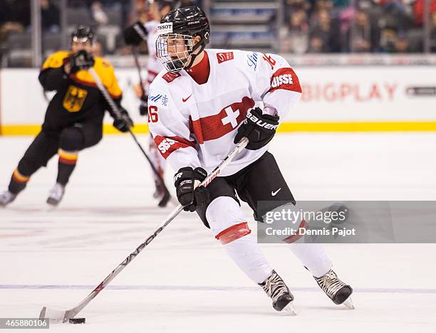 Forward Denis Malgin of Switzerland moves the puck against Germany during the 2015 IIHF World Junior Championship on January 03, 2015 at the Air...