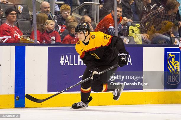 Forward Marc Schmidpeter of Germany moves the puck against Switzerland during the 2015 IIHF World Junior Championship on January 03, 2015 at the Air...