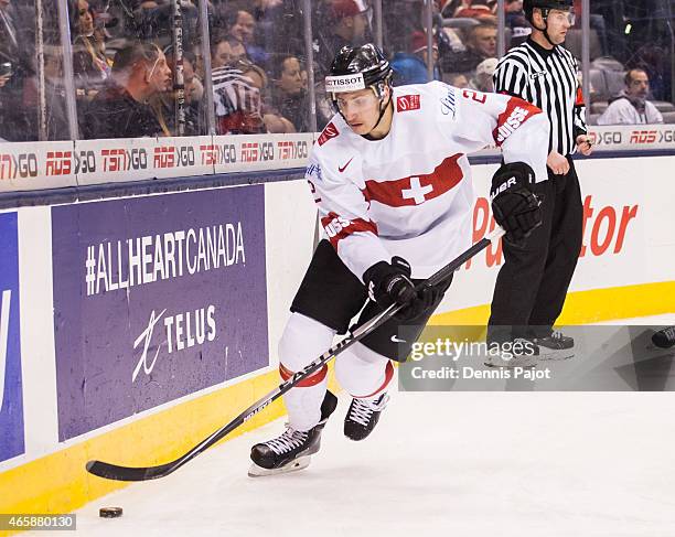 Defenceman Michael Fora of Switzerland moves the puck against Germany during the 2015 IIHF World Junior Championship on January 03, 2015 at the Air...