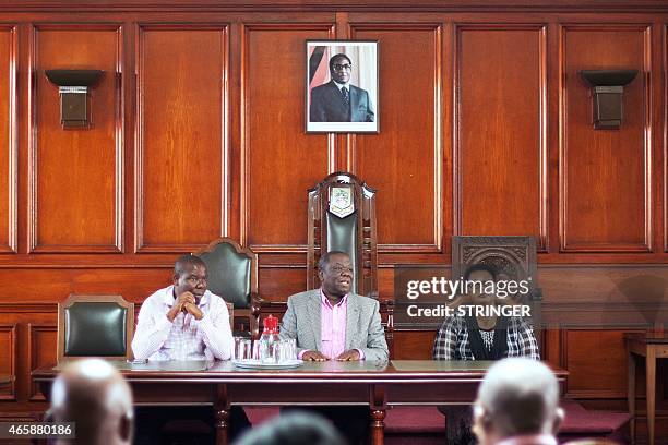 Zimbabwe's main opposition party Movement for Democratic Change president Morgan Tsvangirai speaks, flanked by Bulawayo deputy Mayor Gift Banda and...