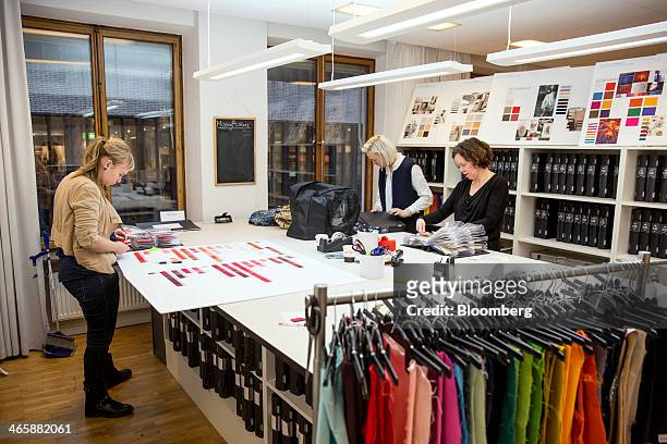 Employees work inside the fashion design studio at the headquarters of Hennes & Mauritz AB in Stockholm, Sweden, on Thursday, Jan. 30, 2014. Hennes &...