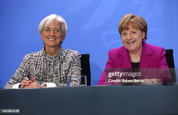 International Monetary Fund Managing Director Christine Lagarde and German Chanceller Angela Merkel attend a press conference at the German federal...