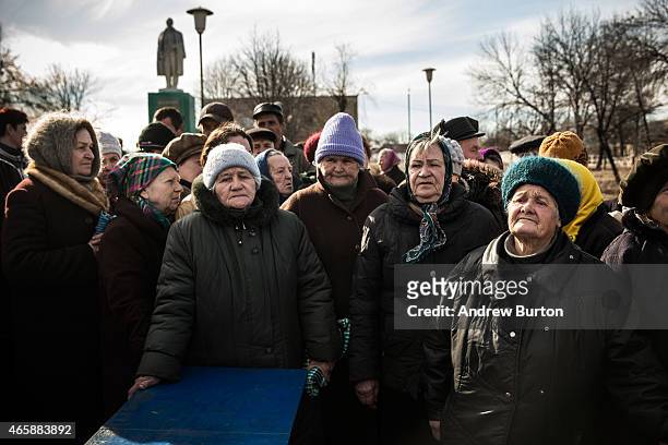 Elderly women wait for pro-Russian rebels to hand out humanitarian aid on March 11, 2015 in Chornukyne, Ukraine. Chornukyne, a small village east of...