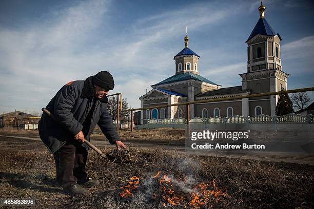 Man burns the grass in front of his house to rejuvinate the soil on March 11, 2015 in Chornukyne, Ukraine. Chornukyne, a small village east of...