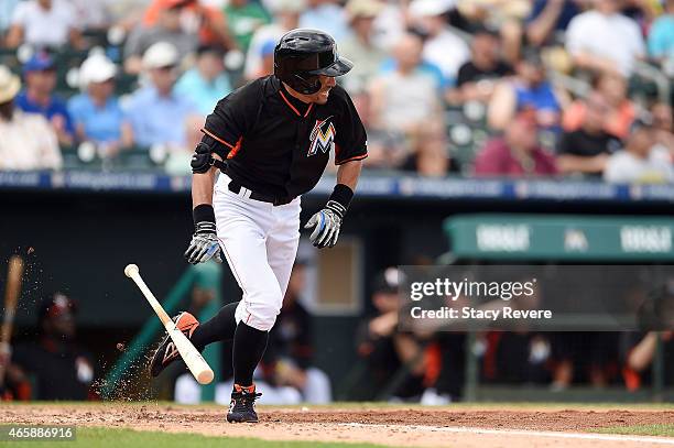 Ichiro Suzuki of the Miami Marlins swings at a pitch during the second inning of a spring training game against the New York Mets at Roger Dean...