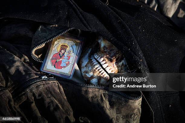 Police officers take the finger prints of a corpse found in a field on March 11, 2015 outside the village of Chornukyne, Ukraine. Pro-Russian rebels...