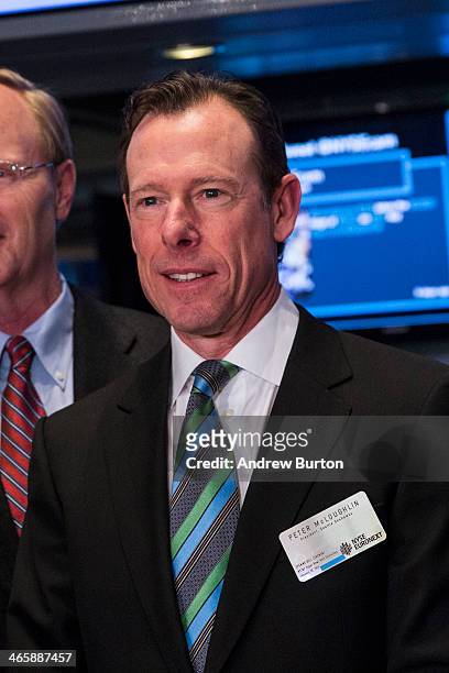 Peter McLoughlin, president of the Seattle Seahawks, arrives on the floor of the New York Stock Exchange on the morning of January 30, 2014 in New...
