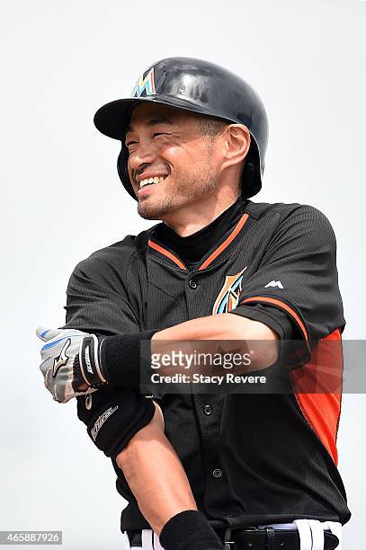 Ichiro Suzuki of the Miami Marlins reacts to a base hit during the second inning of a spring training game against the New York Mets at Roger Dean...