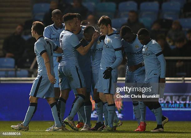 Denzeil Boadu of Manchester City is congratulated by his team-mates after scoring his side's second goal during the FA Youth Cup Semi Final First Leg...