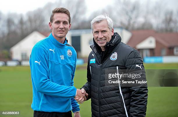 Manager Alan Pardew shakes hands with New Signing Luuk de Jong after a training session at The Newcastle United Training Centre on January 30 in...
