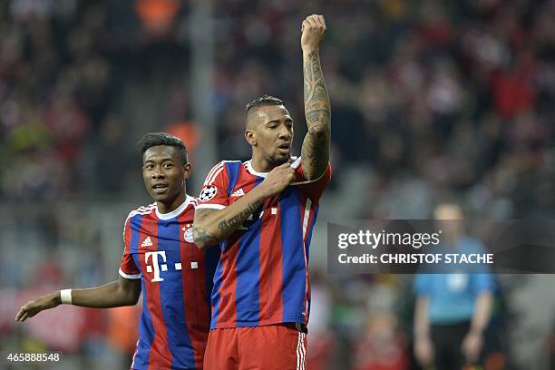 Bayern Munich's defender Jerome Boateng and Bayern Munich's Austrian midfielder David Alaba celebrate after Boateng scored the 2-0 during the UEFA...