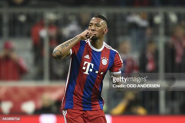 Bayern Munich's defender Jerome Boateng celebrates scoring the 2-0 goal during the UEFA Champions League second-leg, Round of 16 football match FC...
