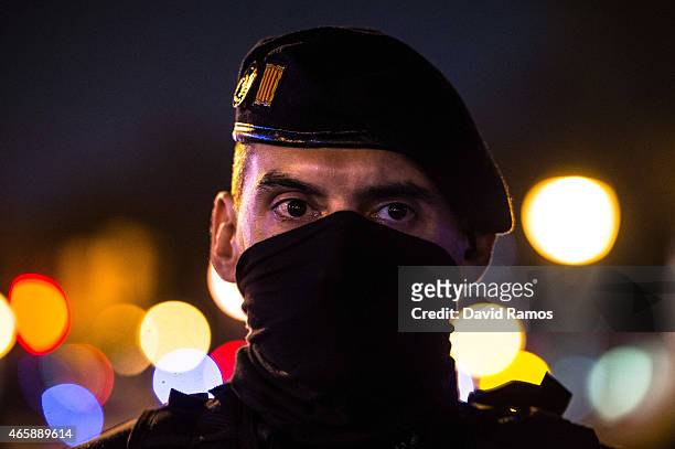 Catalan Autonomous riot police officer stands guard at the first Pegida rally on March 11, 2015 in Barcelona, Spain. Pegida Catalonia has called for...