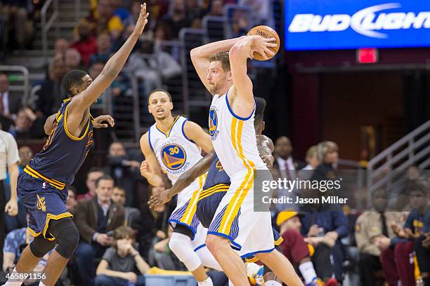 Tristan Thompson of the Cleveland Cavaliers guards David Lee of the Golden State Warriors during the second half at Quicken Loans Arena on February...
