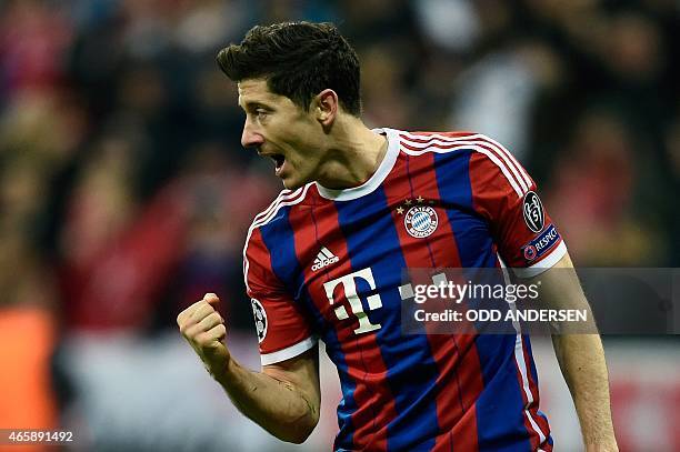 Bayern Munich's Polish striker Robert Lewandowski celebrates scoring the 6-0 goal during the UEFA Champions League second-leg, Round of 16 football...