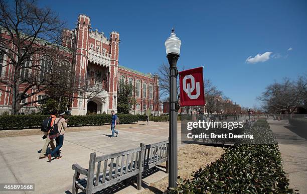 Students walk between classes in front of the Bizzell Memorial Library at the University of Oklahoma Wednesday on March 11, 2015 in Norman, Oklahoma....