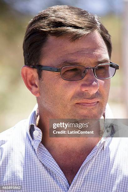 Andrés Navarrete, Major of General Lamadrid department looks on during expert's action in the place where the crash of two helicopters took place...