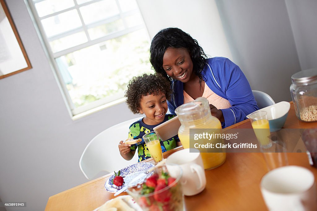 Mother and son having breakfast