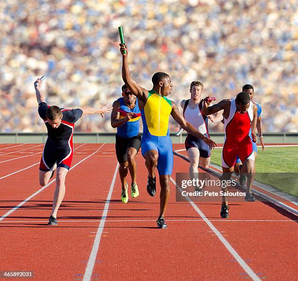 six athletes running relay race - sprinter stock-fotos und bilder