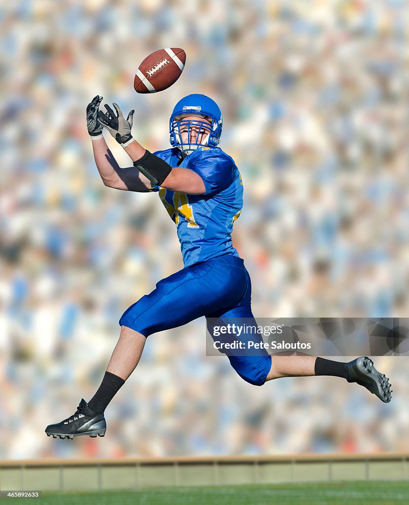 American footballer catching ball