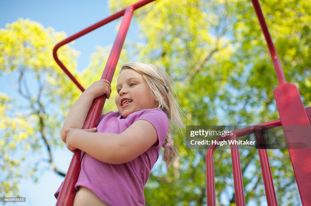 Girl on climbing frame