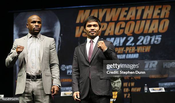 Floyd Mayweather and Manny Pacquiao pose together at the end of their Press Conference promoting their upcoming fight on March 11, 2015 in Los...