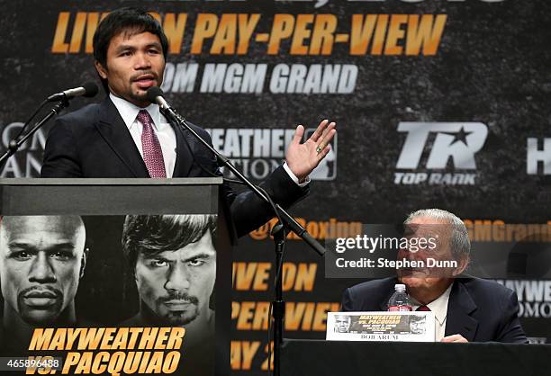 Manny Pacquiao speaks as promoter Bob Arum looks on at the Floyd Mayweather v Manny Pacquiao Press Conference on March 11, 2015 in Los Angeles,...