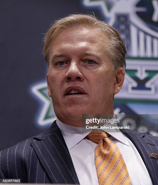 Executiive VP of Football operatiohns, Denver Broncos, John Elway rings the opening bell at New York Stock Exchange on January 30, 2014 in New York...