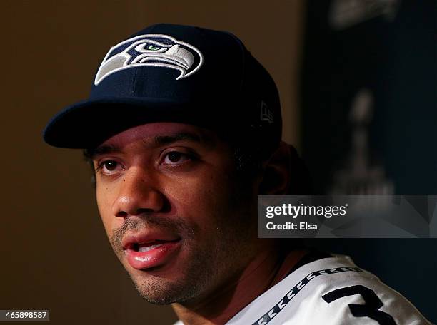 Russell Wilson of the Seattle Seahawks addresses the media during Super Bowl XLVIII media availability at the Westin Hotel January 30, 2014 in Jersey...