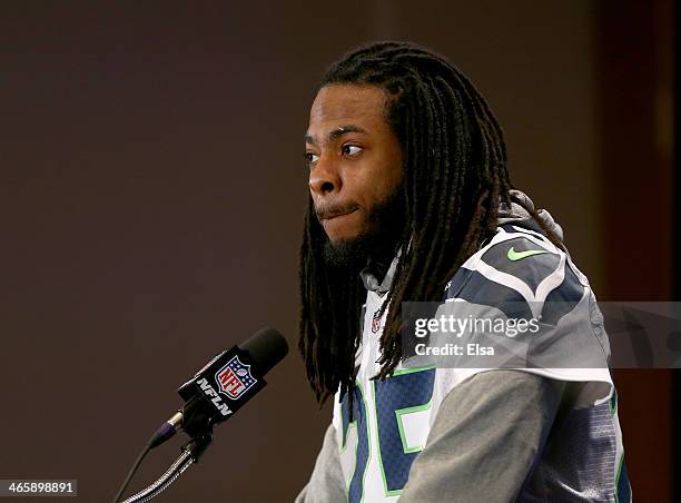 Richard Sherman of the Seattle Seahawks addresses the media during Super Bowl XLVIII media availability at the Westin Hotel January 30, 2014 in...