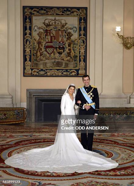 Spanish Crown Prince Felipe of Spain and his wife Princess of Asturias Letizia Ortiz pose inside the Royal Palace in Madrid 22 May 2004. AFP PHOTO...