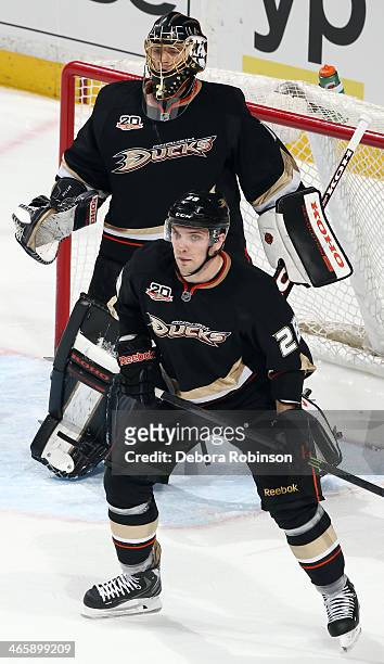 Mark Fistric and Jonas Hiller of the Anaheim Ducks defend the net during the game against the Boston Bruins on January 7, 2014 at Honda Center in...