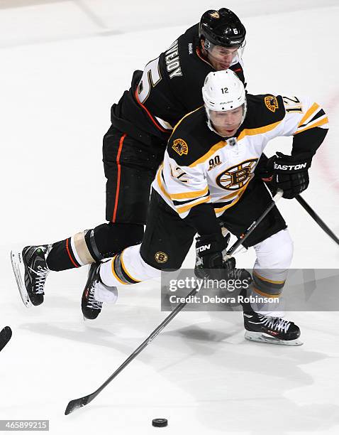 Jarome Iginla of the Boston Bruins handles the puck against Ben Lovejoy of the Anaheim Ducks on January 7, 2014 at Honda Center in Anaheim,...