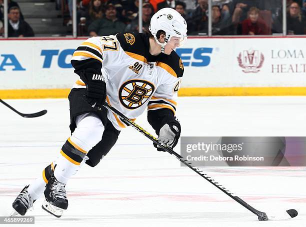 Torey Krug of the Boston Bruins handles the puck during the game against the Anaheim Ducks on January 7, 2014 at Honda Center in Anaheim, California.