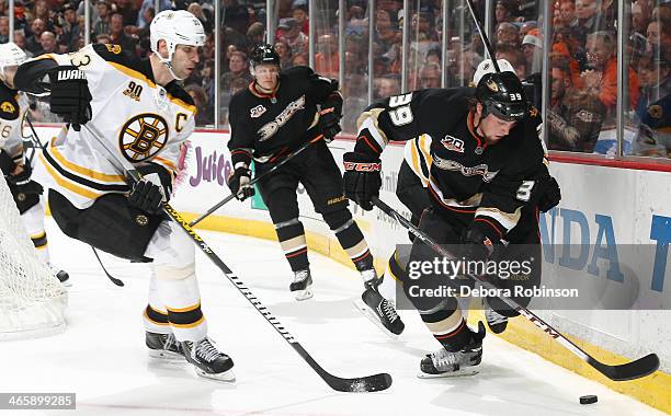 Matt Beleskey of the Anaheim Ducks handles the puck against Zdeno Chara of the Boston Bruins on January 7, 2014 at Honda Center in Anaheim,...