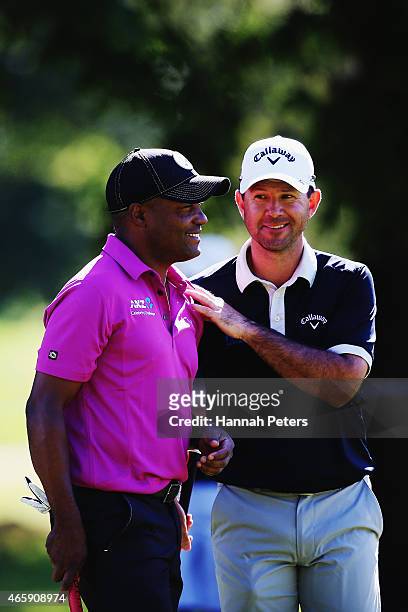 Former cricketers Brian Lara and Ricky Ponting walk to the green during day one of the New Zealand Open at Millbrook Resort on March 12, 2015 in...