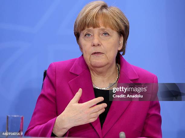 German Chancellor Angele Merkel attends a press conference after a meeting with the heads of the World Bank, the World Trade Organization, the...