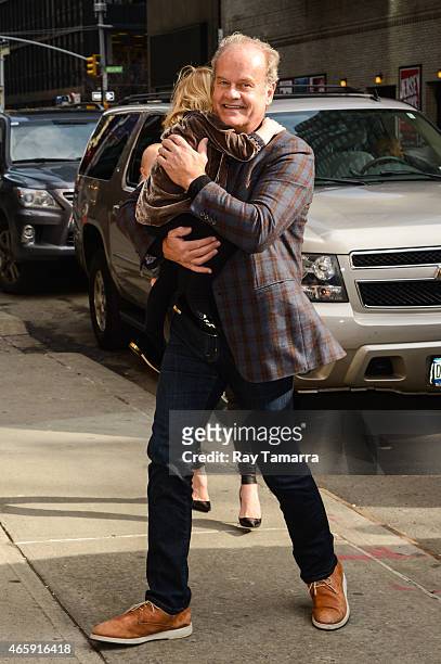 Actor Kelsey Grammer and Faith Grammer enter the "Late Show With David Letterman" taping at the Ed Sullivan Theater on March 11, 2015 in New York...