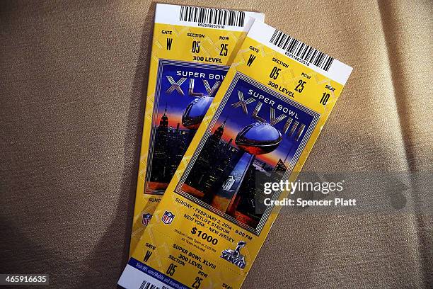 Authentic game tickets are viewed at a news conference on the latest seizure of counterfeit sports-related merchandise leading up to Super Bowl...